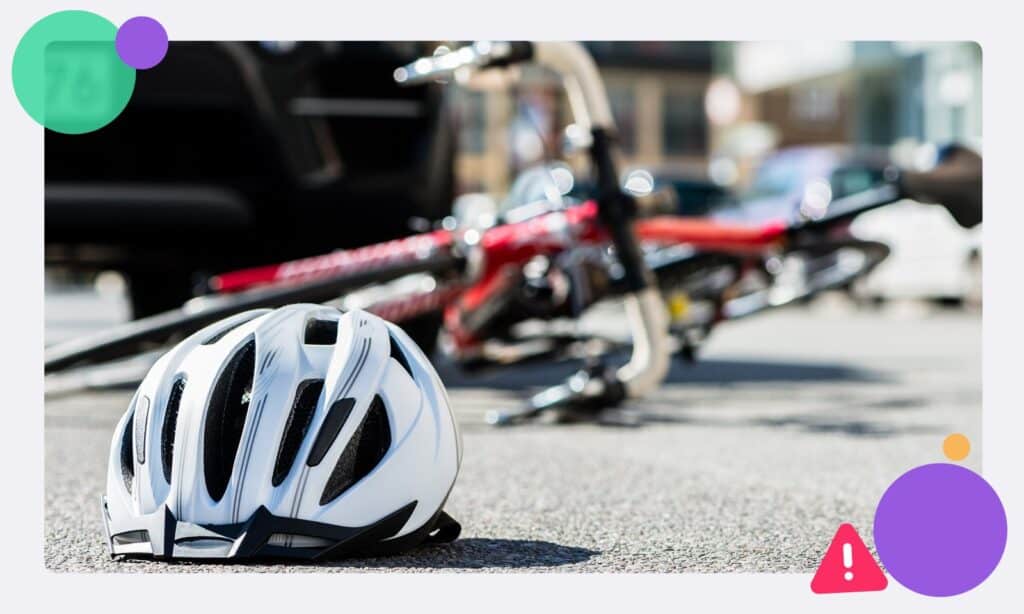 A crashed bicycle with a helmet on the floor