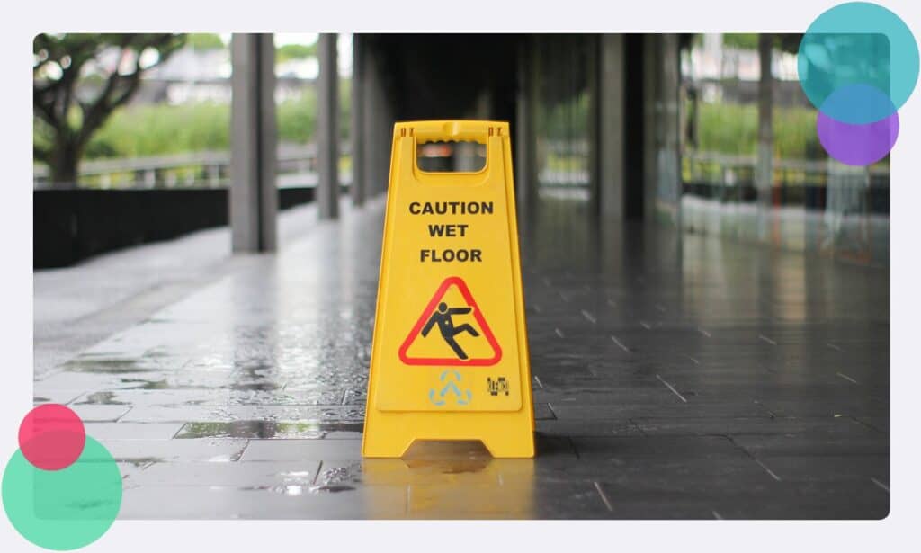 A slips trips and falls sign outside of an airport