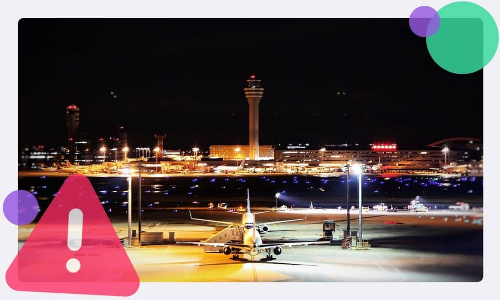 An airport with a warning sign in the corner