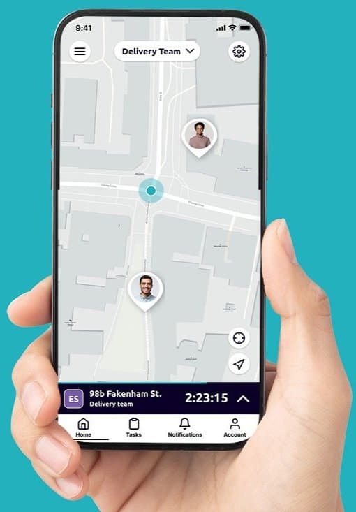 A hand holding a smartphone with the Safepoint lone worker app open on the map