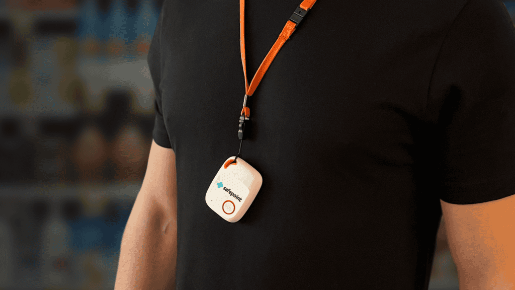 A person wearing the Safepoint multi net sim based lone worker device on a lanyard