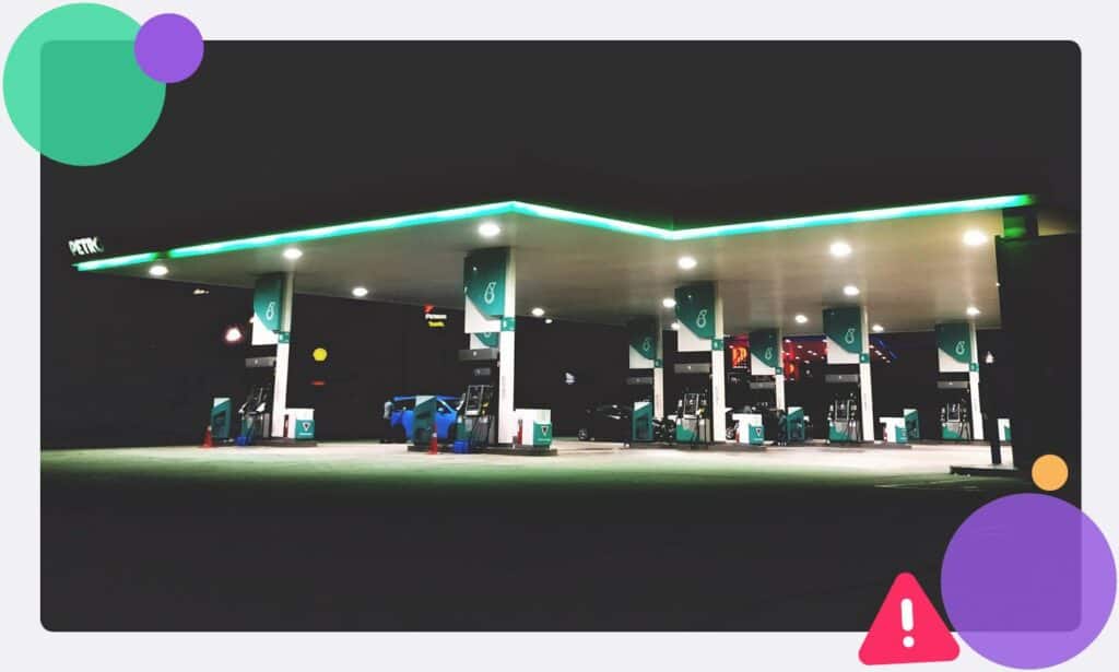 A gas station or garage forcourt at night