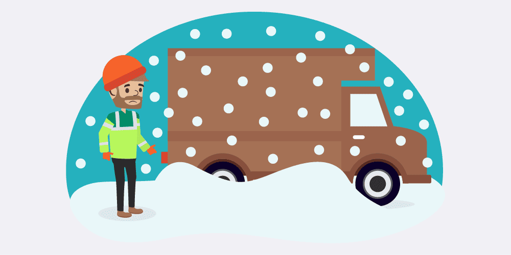 A driver standing outside of his van in the snow