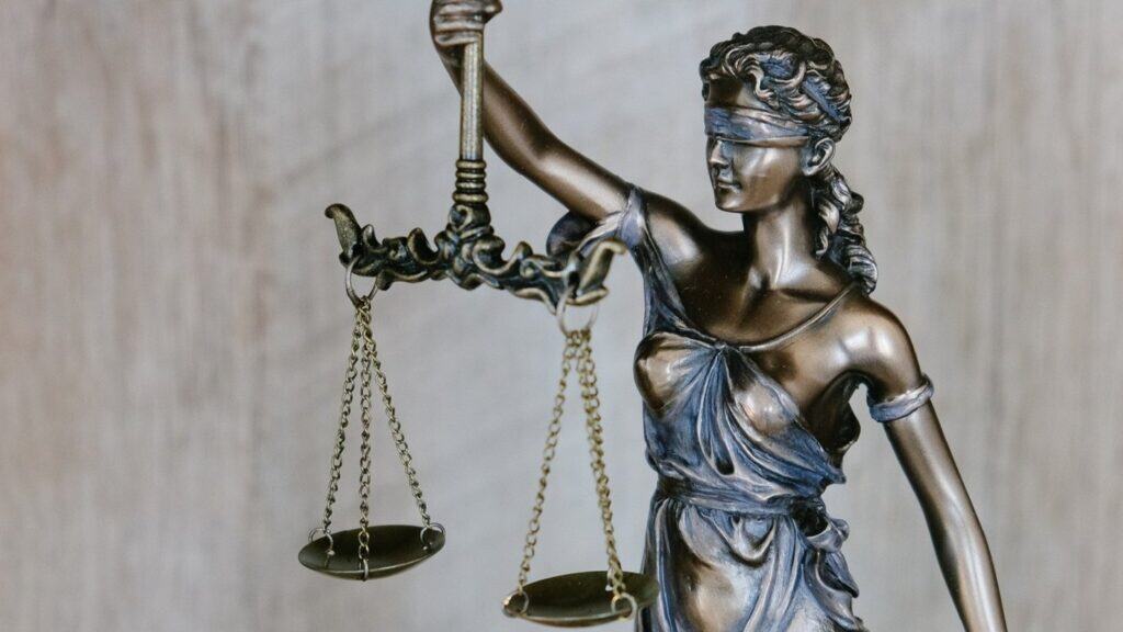A legal statue holding scales