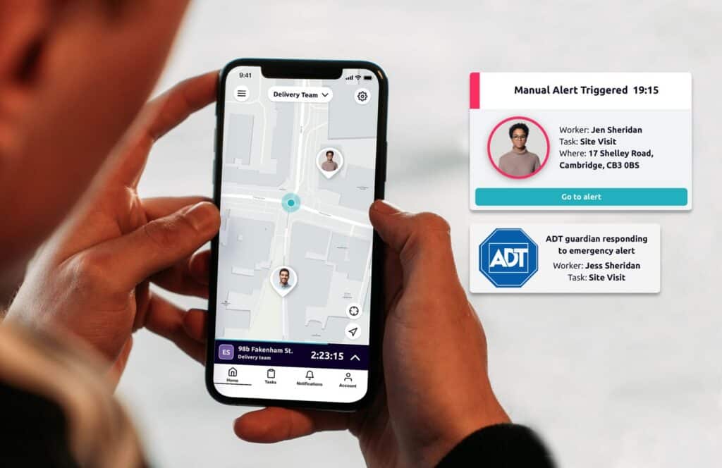 An employee holding smartphone with the safepoint safety app open looking at a map of nearby colleagues
