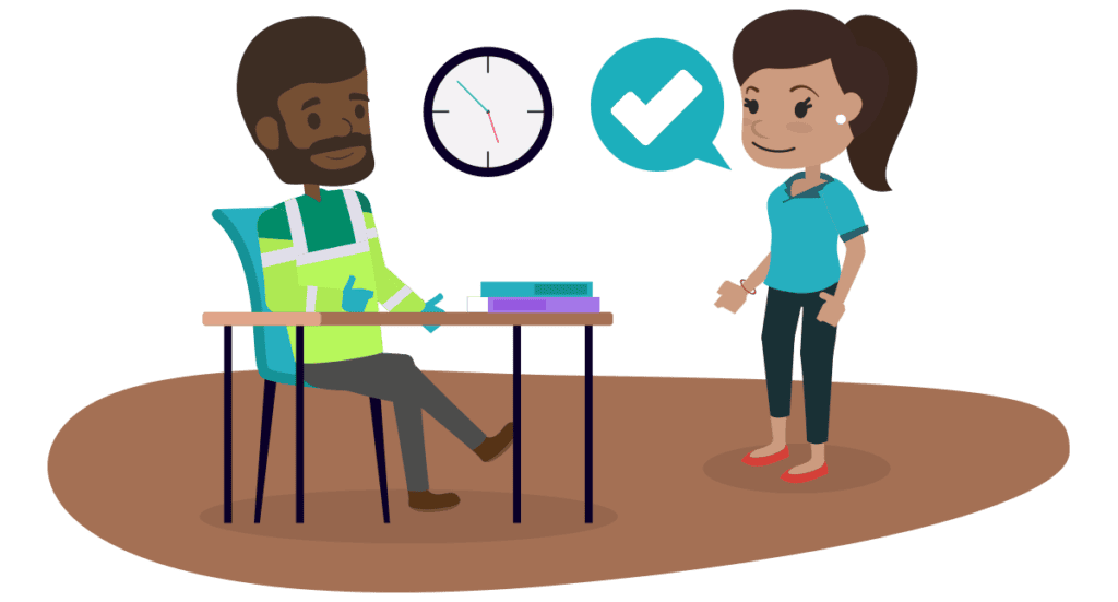 Two employees, one sitting at a desk with books and the other standing