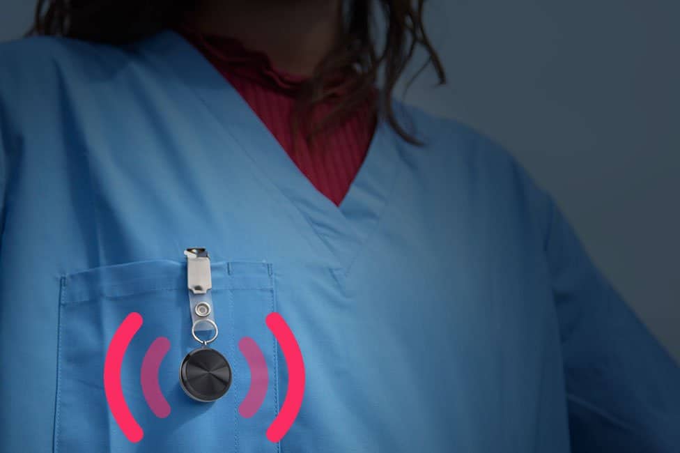 A healthcare worker wearing a safepoint panic alarm