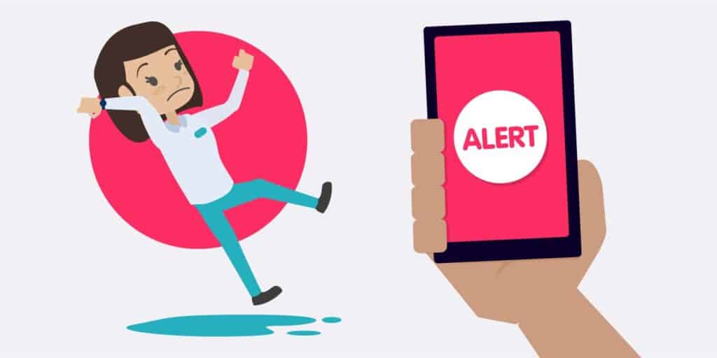 A lone worker slipping on wet floor and an alarm being raised on a safety app