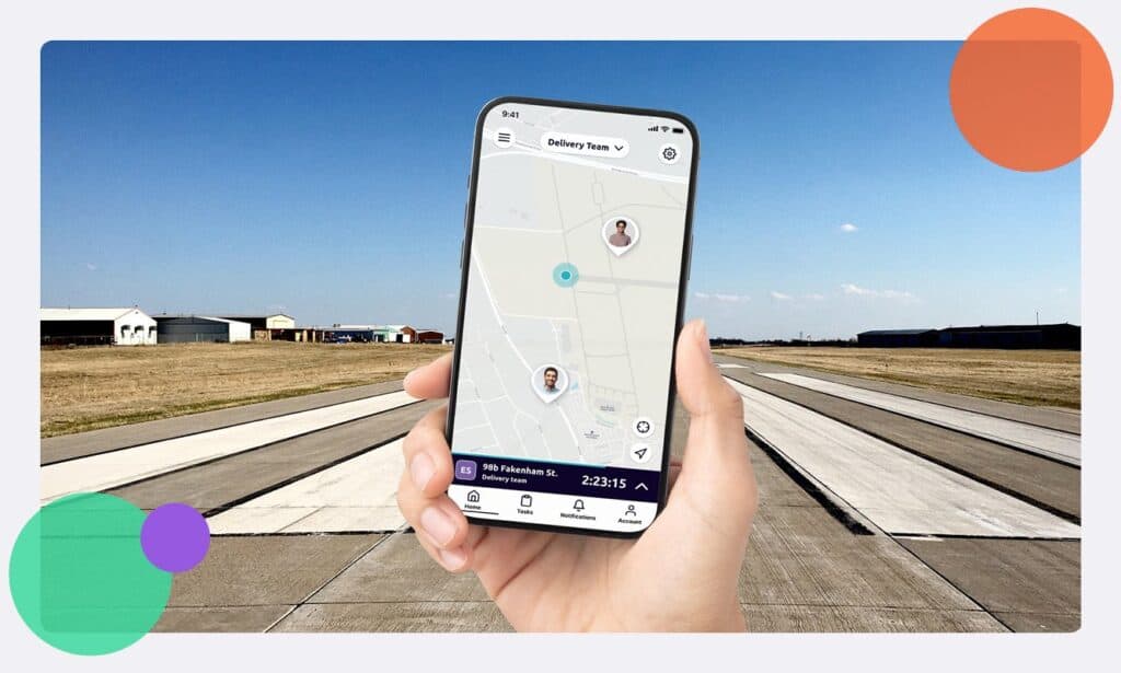 A person holding up the Safepoint safety app on a phone whilst on an airfield
