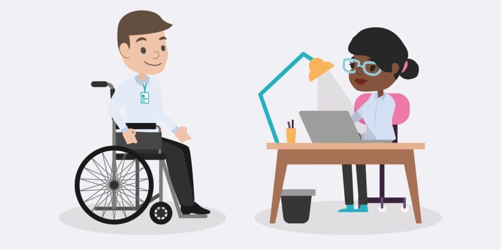 A person in a wheelchair next to a person at a desk on a laptop
