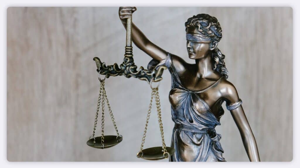 A legal statue holding scales