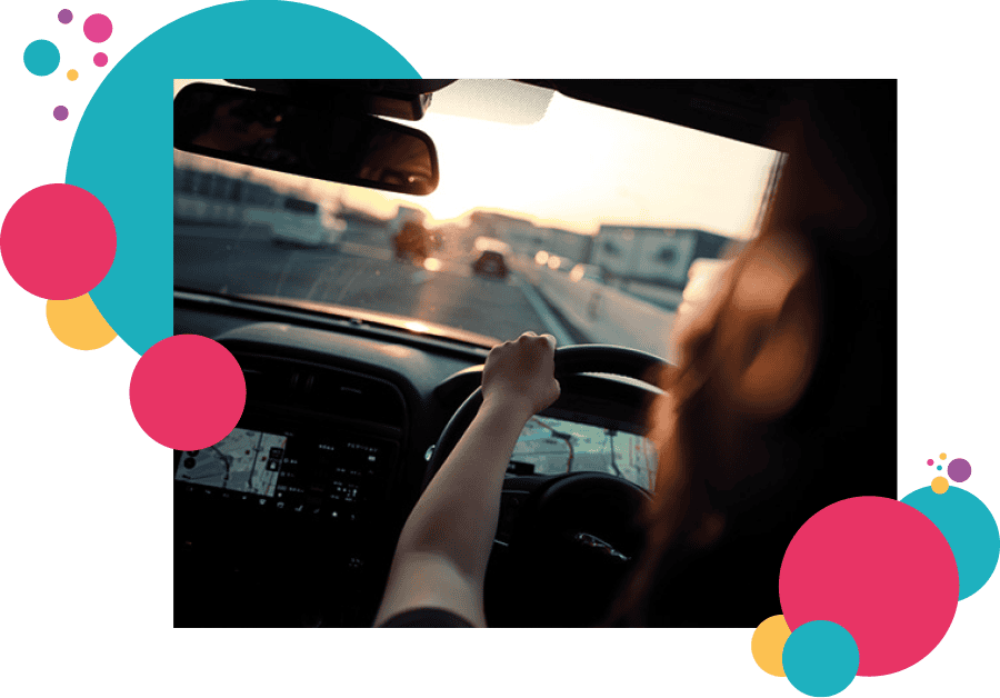 A lone working woman driving a car on a highway