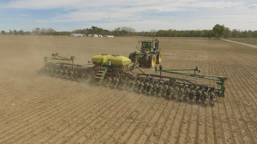 A large seed machinery in use in an agricultural field