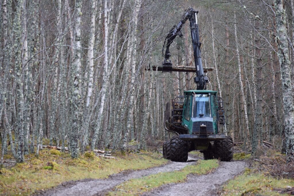 A large forestry vehicle moving logs