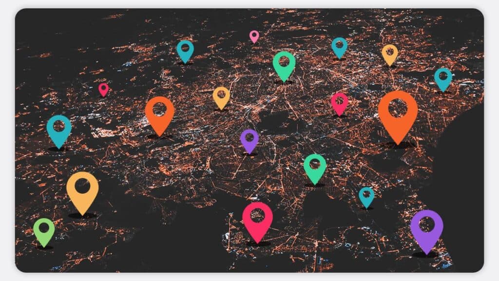 A large city at night with map pins dotted around in various locations