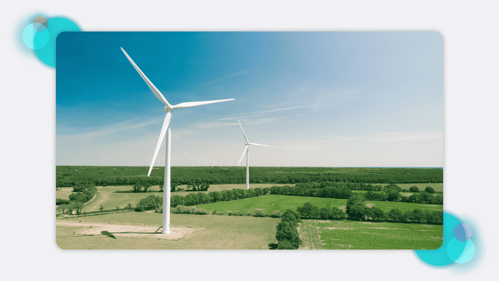 A landscape scene with two wind turbines
