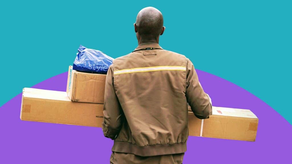 A delivery worker carrying multiple packages