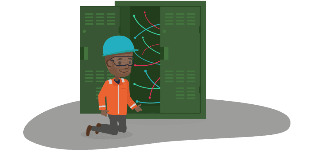 A utilities engineer working in a telephony cabinet with no colleagues nearby