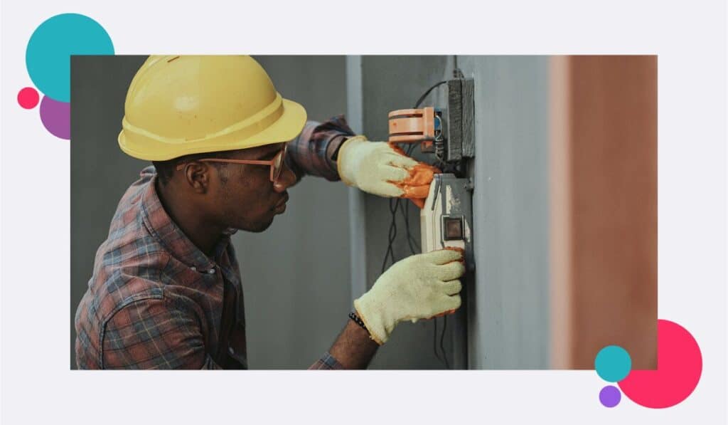 A utilities worker installing equipment with no colleagues nearby