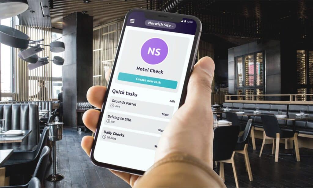 A person using the safepoint lone worker app in an empty restaurant