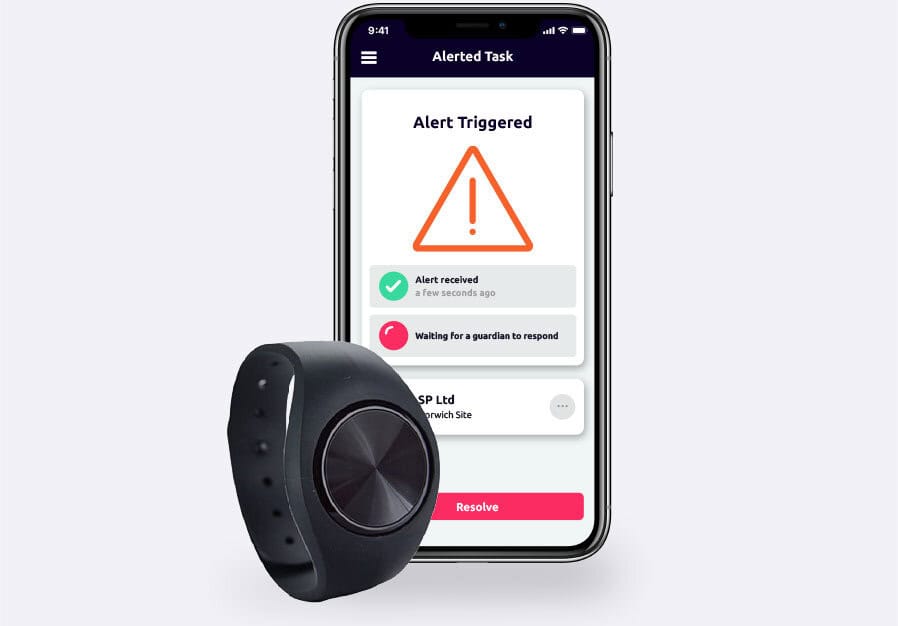 The Safepoint lone worker mobile app on a smartphone next to the wearable panic alarm bluetooth accessory