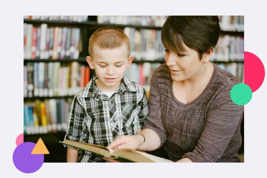 A teacher working alone with a child in a school library