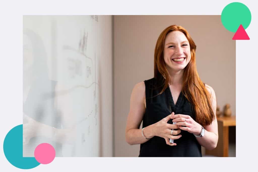 A teacher at a school smiling