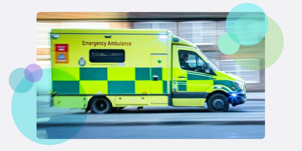 An ambulance driving along a road