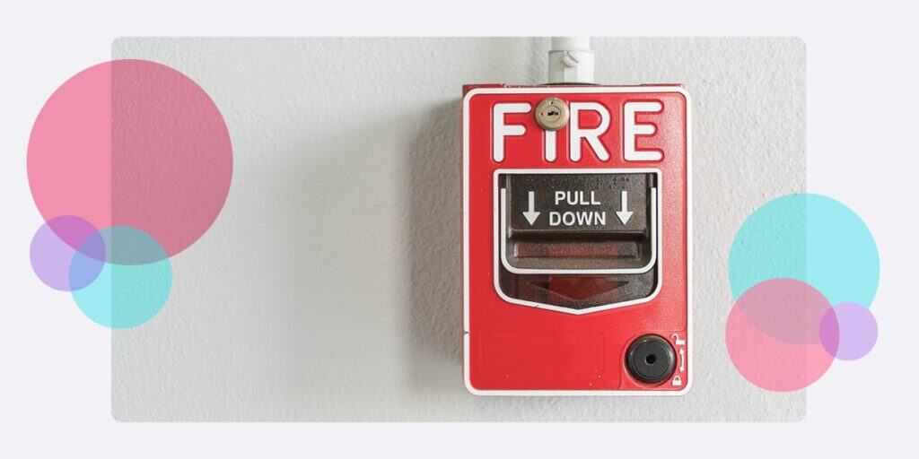 A fire alarm trigger attached to a wall