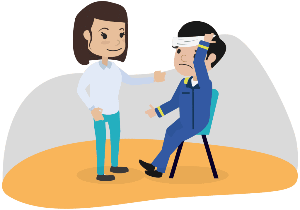 An injured colleague being treated by a company assigned first aider