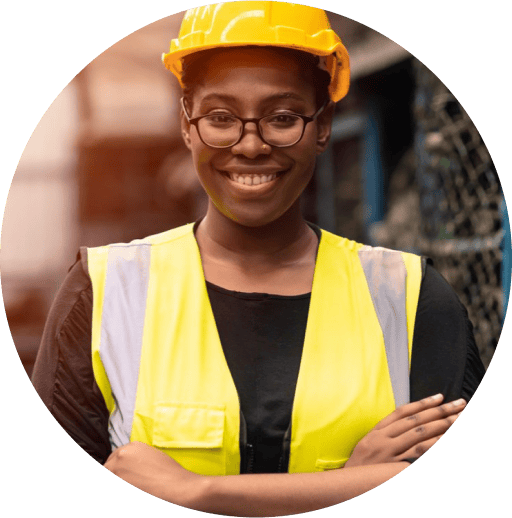 A construction worker with their arms crossed