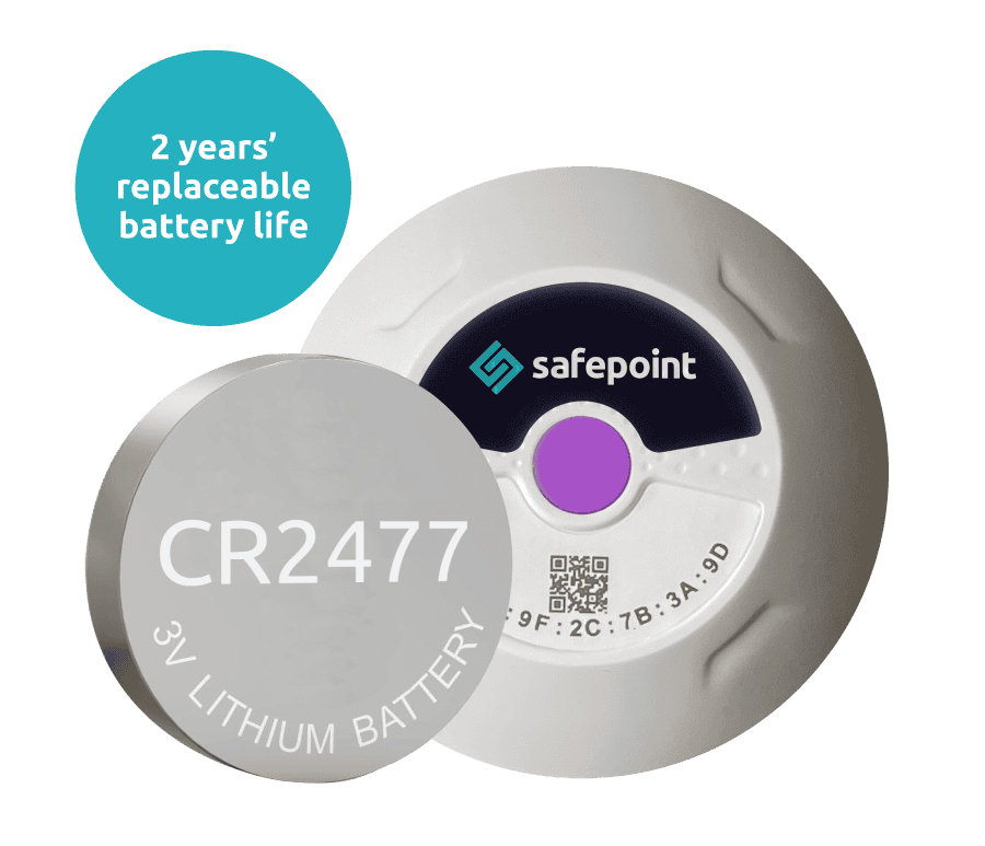 A location beacon next to its replaceable battery