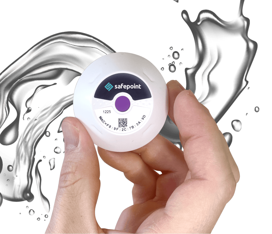 A Safepoint location beacon held near a splash of water