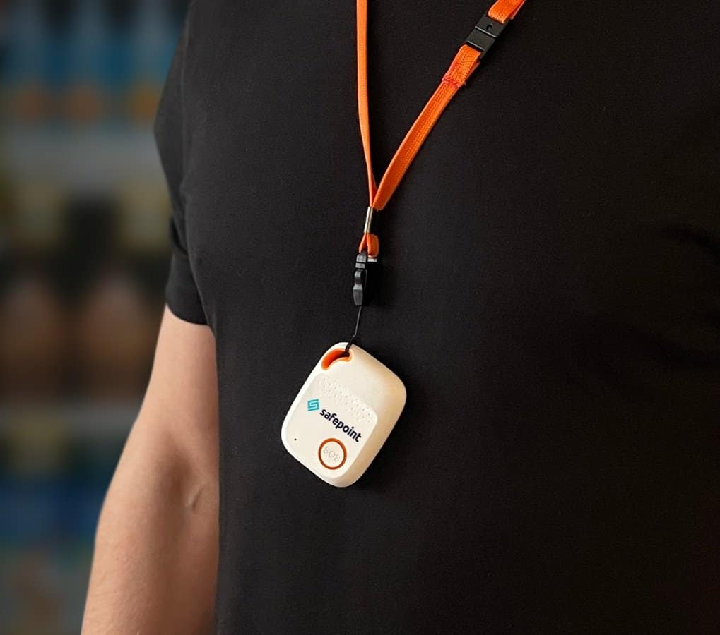 A lone worker device worn on a lanyard